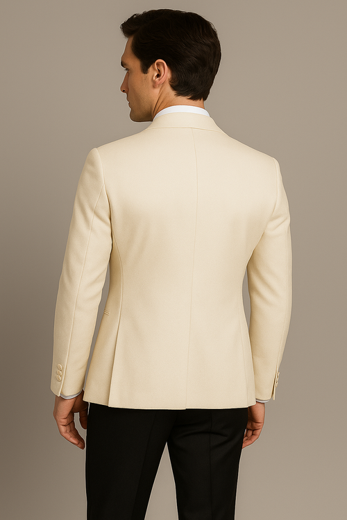 Man wearing a beige suit jacket on a plain background